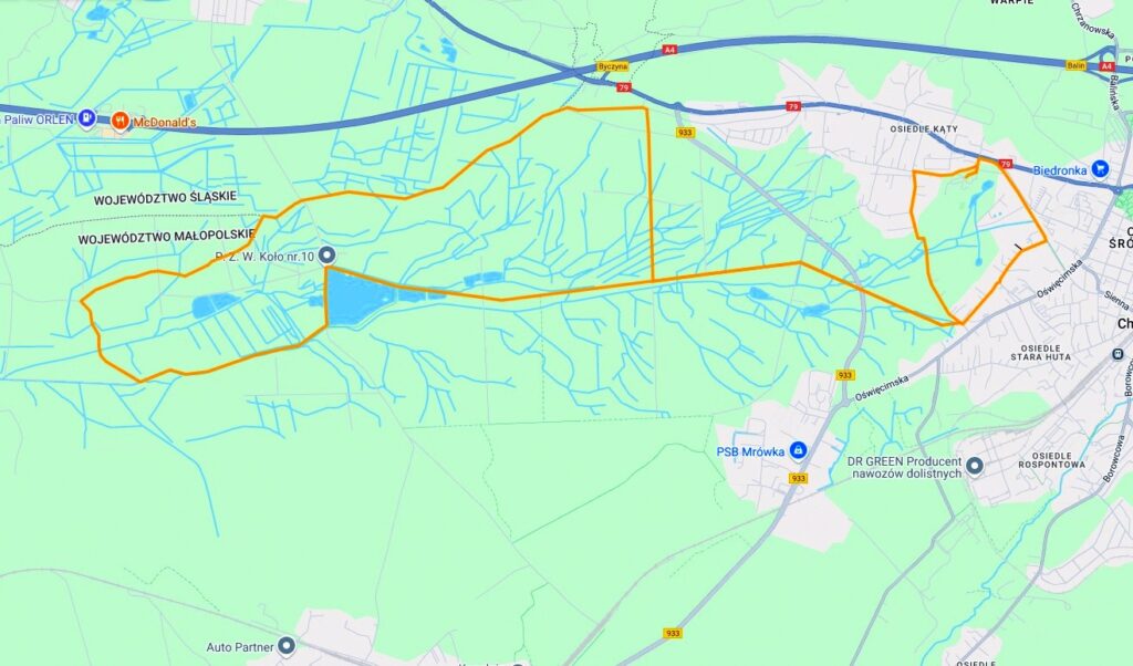 Mapa obszaru Chrzanowa, w tym drogi, rzeki i oznaczone punkty takie jak McDonald's, Auto Partner i PSG Młówa.